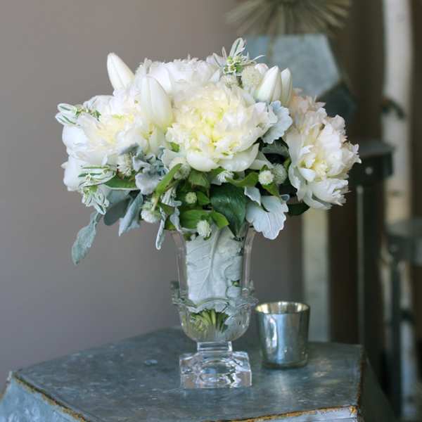 White floral arrangement in a clear glass vase