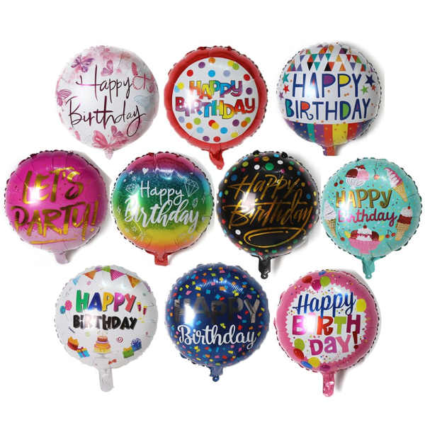 Assorted round birthday balloons with colorful printed messages.