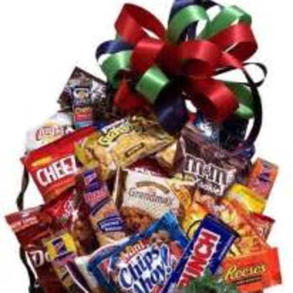 Basket of assorted snack bags topped with a large ribbon bow