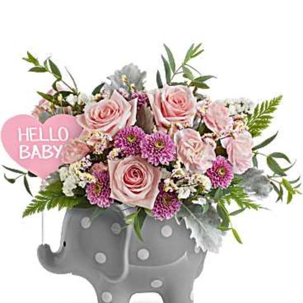 Pink roses and purple flowers in a gray elephant planter with a "Hello Baby" sign