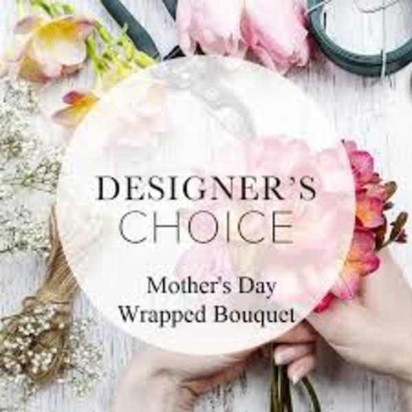 Wrapped bouquet with pink and white flowers and a Mother's Day label