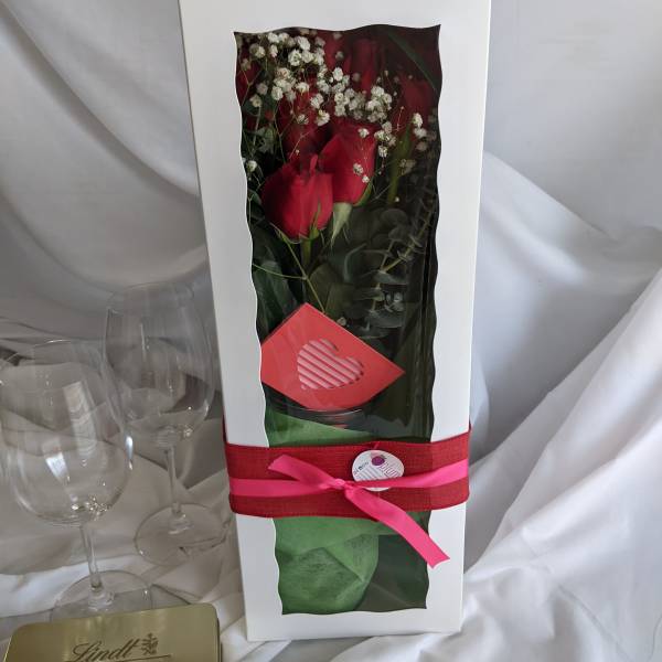 Boxed bouquet of red roses with white baby's breath