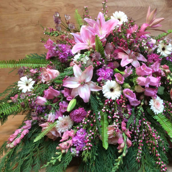 Large pink and white floral spray with lilies and daisies