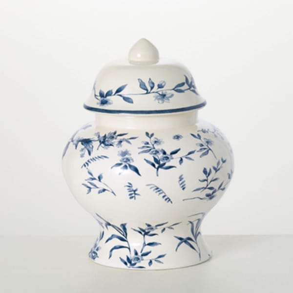 Blue-and-white ceramic urn with a floral pattern and lid
