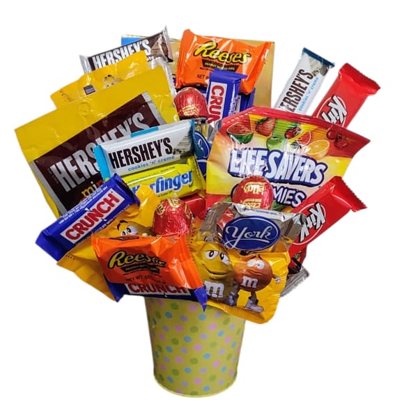Candy bouquet in a polka-dot cup with assorted chocolate bars and candies