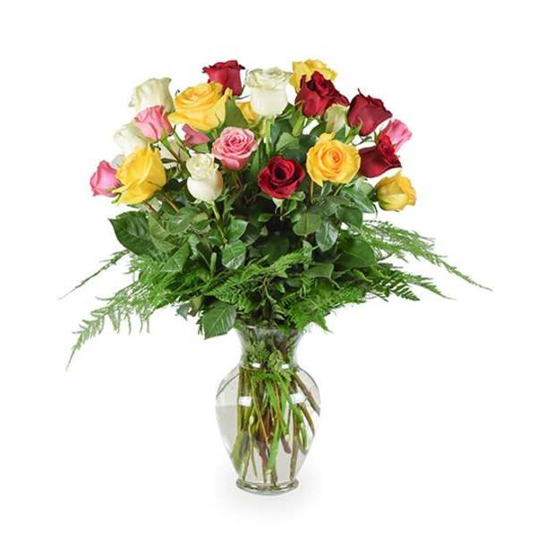 Bouquet of multicolored roses in a clear glass vase