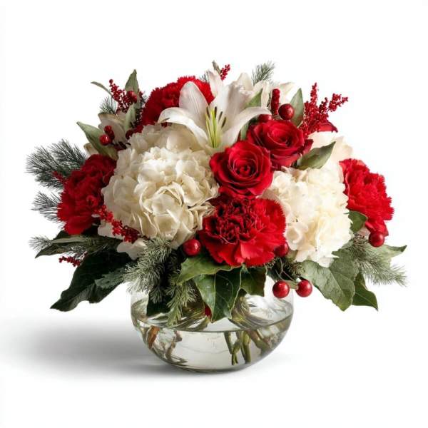Red and white floral arrangement in a clear glass bowl vase