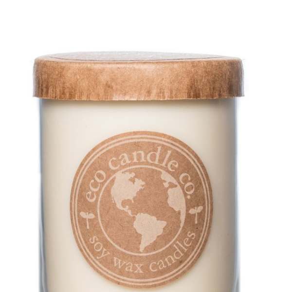 Soy wax candle in a glass jar with a wooden lid