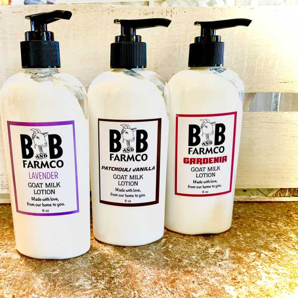 Three bottles of goat milk lotion with pump tops