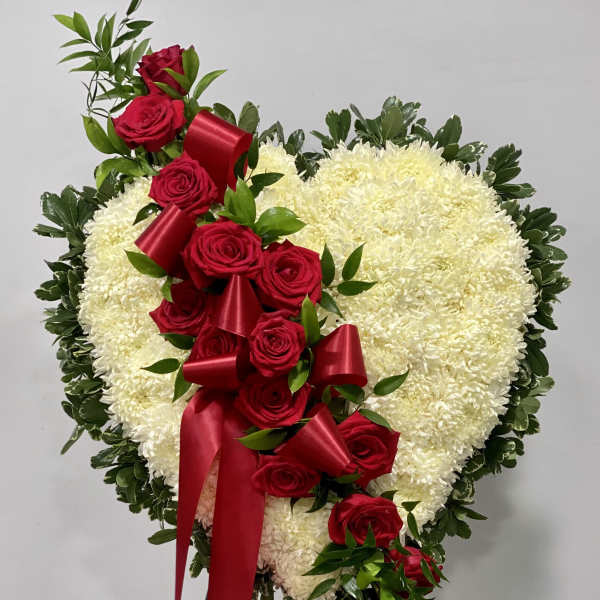 Heart-shaped floral spray with red roses and white chrysanthemums
