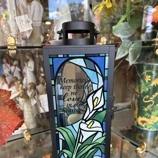 Black memorial lantern with stained-glass calla lily design and quote
