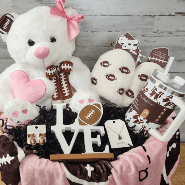 Basket of teddy bears and football-themed gifts with a LOVE sign
