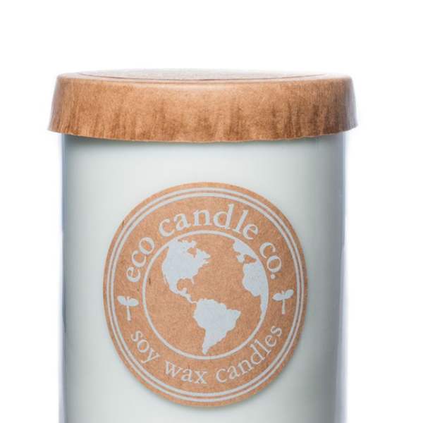 Soy wax candle in a glass jar with a wooden lid