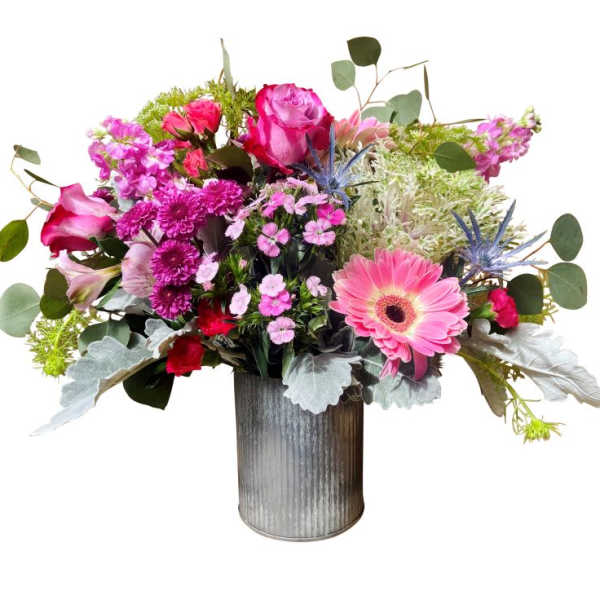 Pink mixed flower arrangement in a gray metal vase