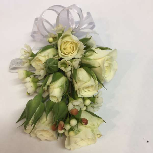 Small white rose corsage with ribbon loops