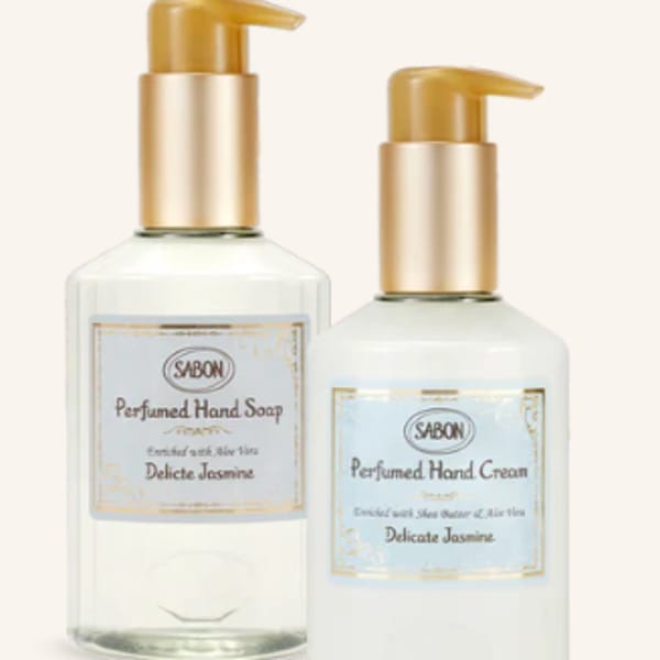 Two pump bottles of scented hand soap and hand cream