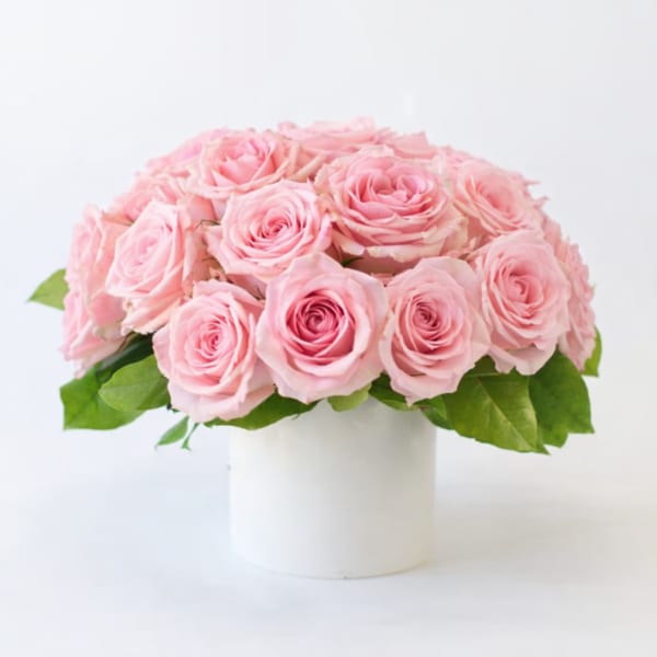 Pink rose bouquet in a white vase