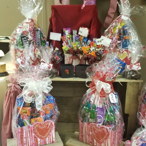 Gift baskets filled with assorted candy and wrapped in clear cellophane