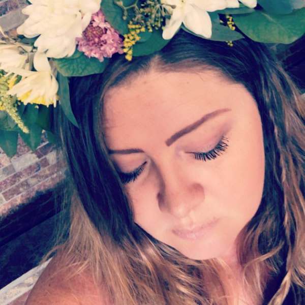 Woman wearing a white and yellow flower crown