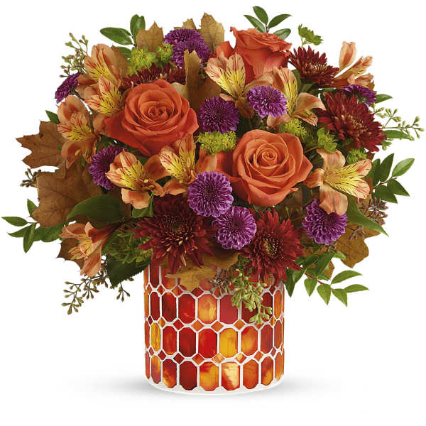 Orange roses and purple mums in a mosaic glass vase