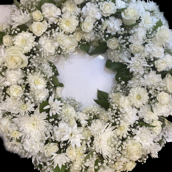 White floral wreath with roses and daisies