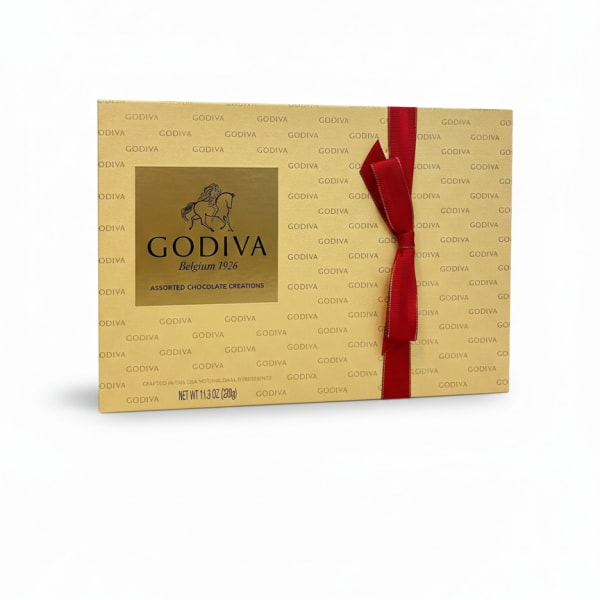 Gold Godiva chocolate gift box tied with a red ribbon