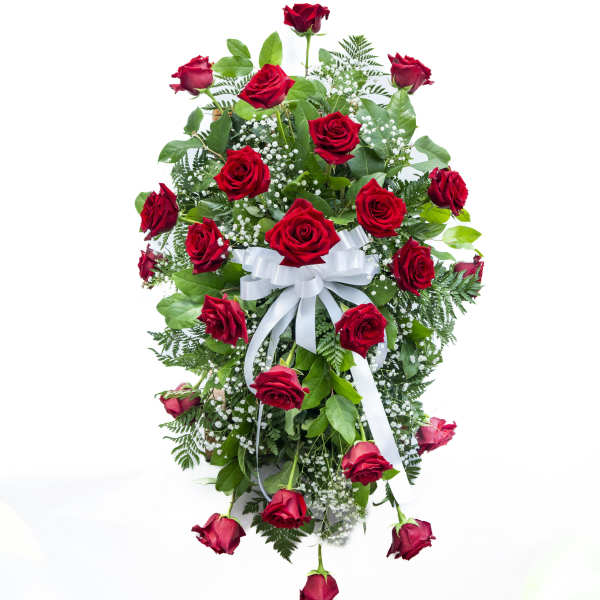Cascade of red roses with white ribbon and baby's breath
