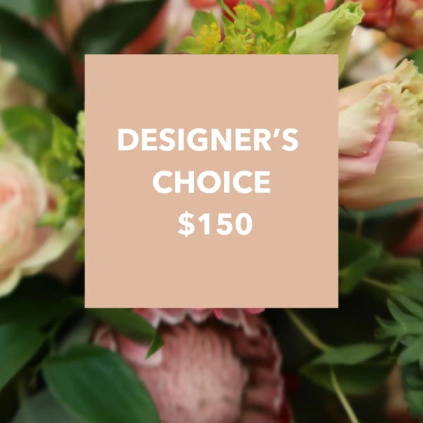 Designer’s choice floral arrangement with pink and cream blooms