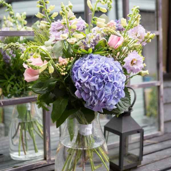 Lavender and pink bouquet in a clear glass vase
