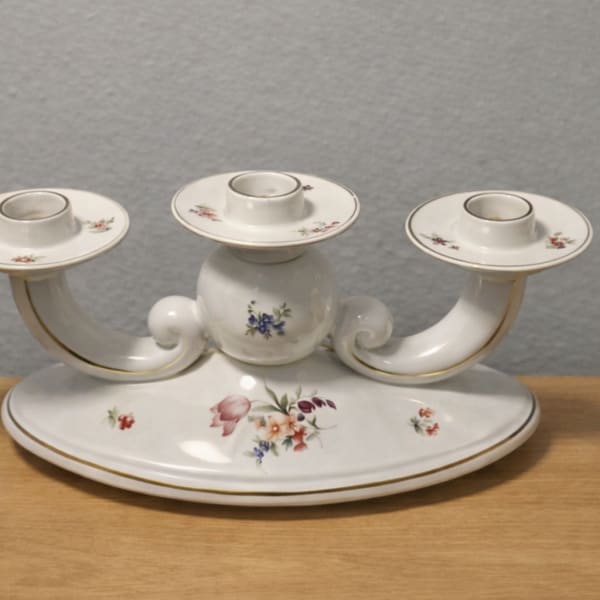 White porcelain three-arm candle holder with small floral decals