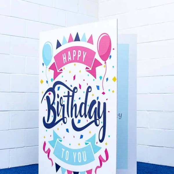 Birthday greeting card with balloons and confetti