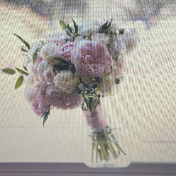 Pink and white bouquet with roses and ruffled blooms
