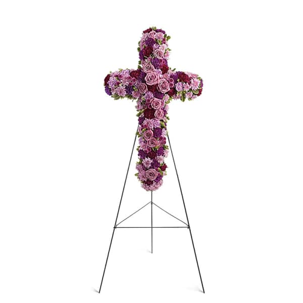 Purple floral cross on a black stand
