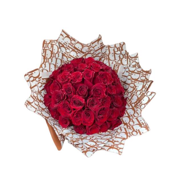 Bouquet of red roses wrapped in patterned paper