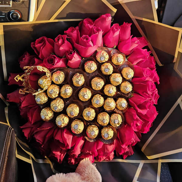 Bouquet of hot pink roses with Ferrero Rocher chocolates and a gold crown