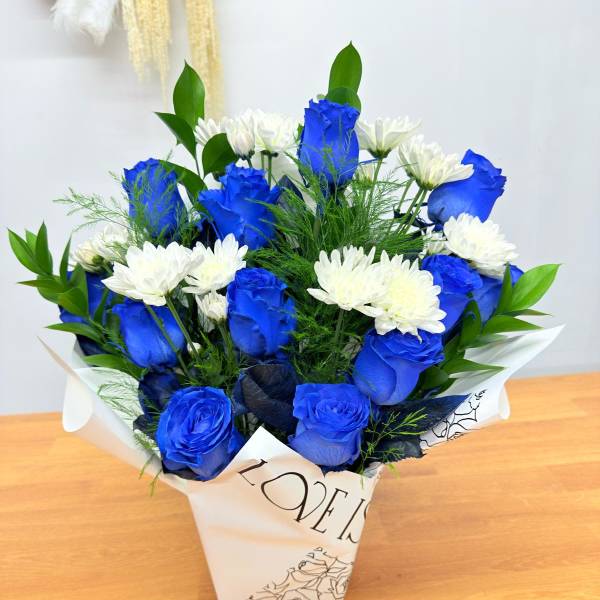 Blue roses and white daisies in a paper wrap