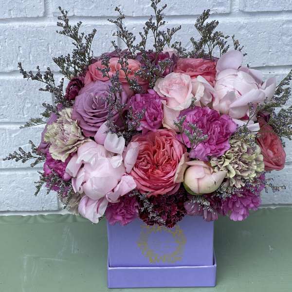 Pink and lavender bouquet in a purple box