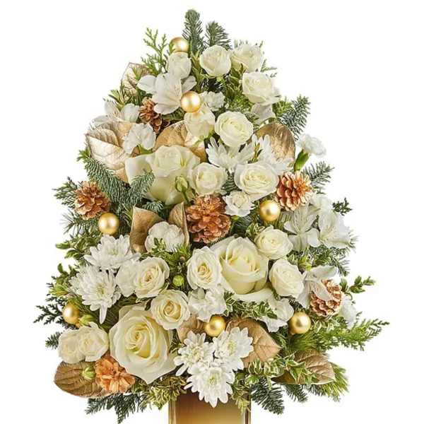 White roses and daisies arranged in a gold vase with pinecones and ornaments