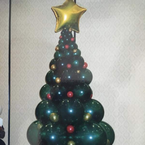 Balloon Christmas tree topped with a gold star