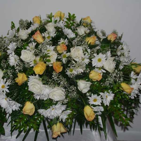 Large white and yellow floral spray with daisies and roses