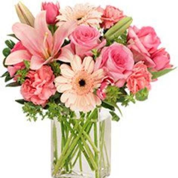 Pink mixed bouquet in a clear glass vase