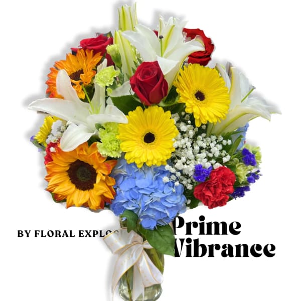 Mixed bouquet with lilies, roses, gerbera daisies, and hydrangea in a glass vase
