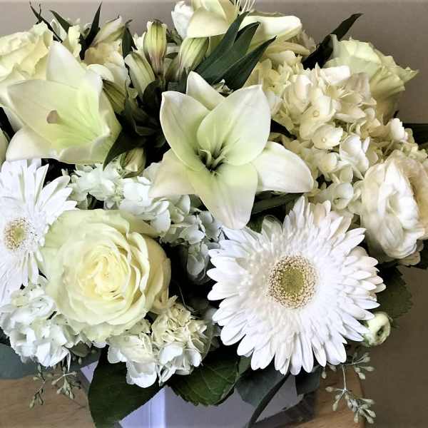 White bouquet with lilies, roses, gerbera daisies, and hydrangea