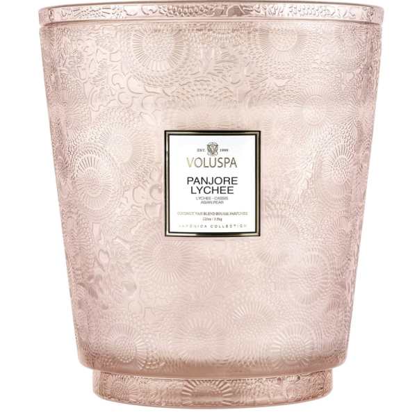 Pink patterned candle in a decorative glass vessel