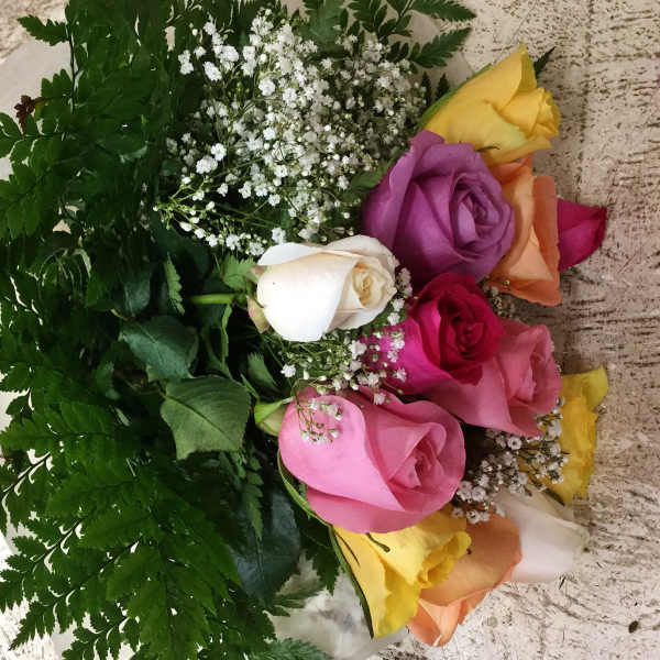 Bouquet of multicolored roses with white baby's breath