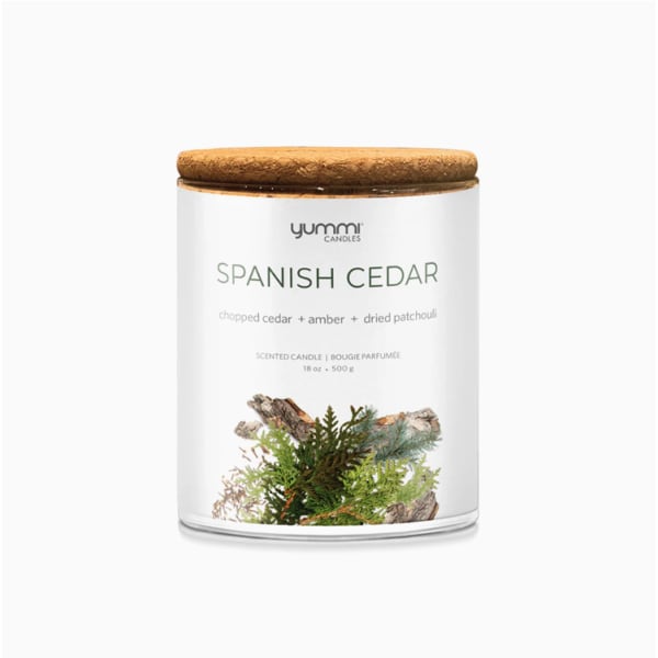 Scented candle in a glass jar with a wooden lid