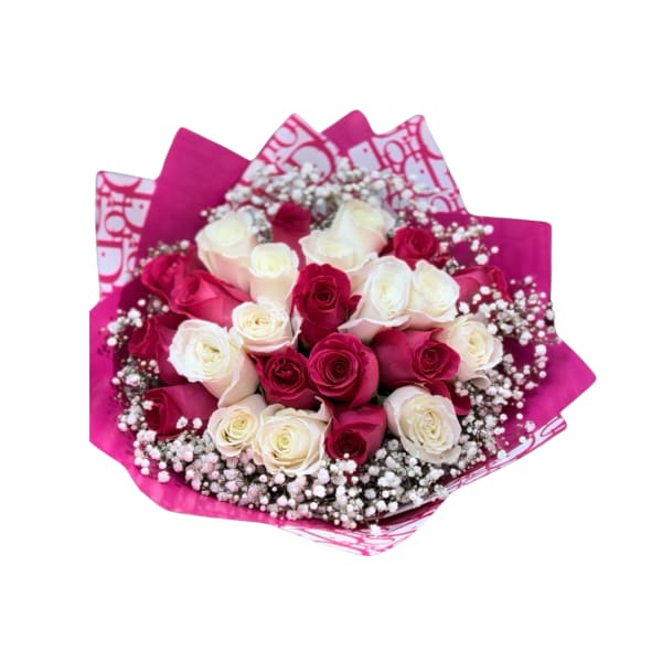 Bouquet of pink and white roses wrapped in bright pink paper