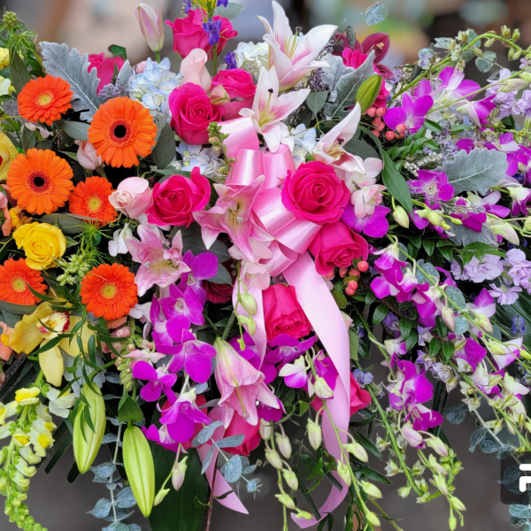 Large mixed bouquet with pink, yellow, orange, and white flowers