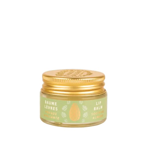 Small gold-lidded jar of lip balm with a green label