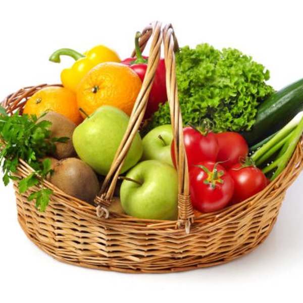 Wicker basket filled with assorted fruit and vegetables